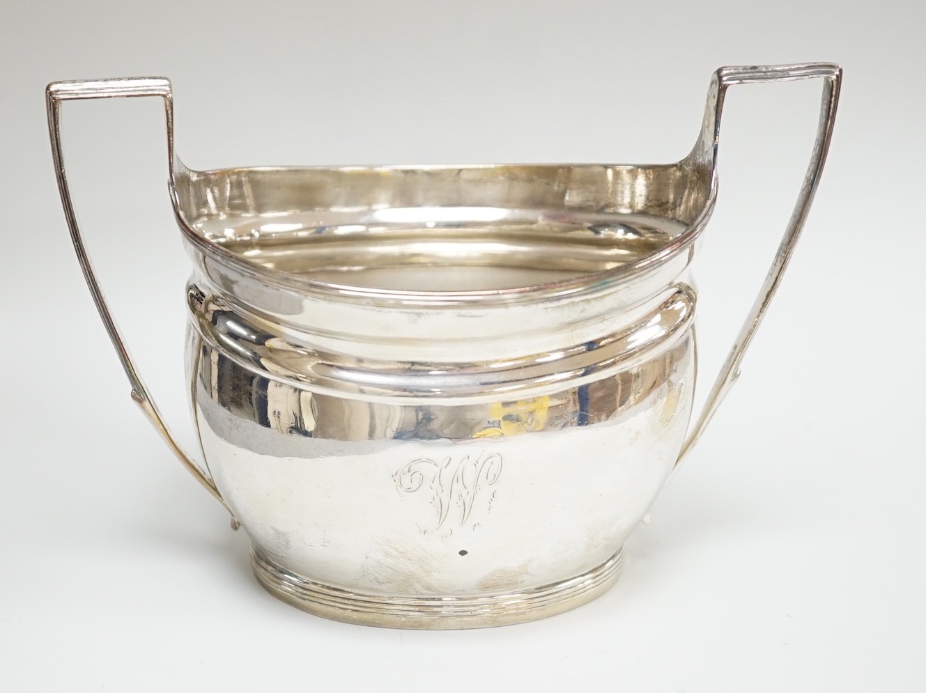 A George III silver two handled sugar bowl, by Thomas Wallis II, London, 1800, 15cm over handles, 6.4oz.